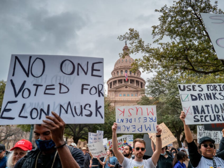 AUSTIN, TEXAS - FEBRUARY 05: People prepare to march while protesting against U.S. Preside