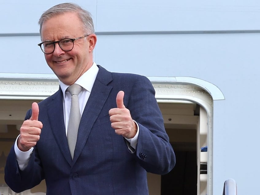 CANBERRA, AUSTRALIA - MAY 23: Prime Minister Anthony Albanese stands with newly appointed Foreign Minister Penny Wong, at the door of their plane on May 23, 2022 in Canberra, Australia. Albanese is travelling to Japan to attend the QUAD Leaders' meeting in Tokyo. Albanese was sworn in as Australia's 31st prime minister on Monday morning following his victory over Scott Morrison in the federal election on Saturday. (Photo by David Gray/Getty Images)