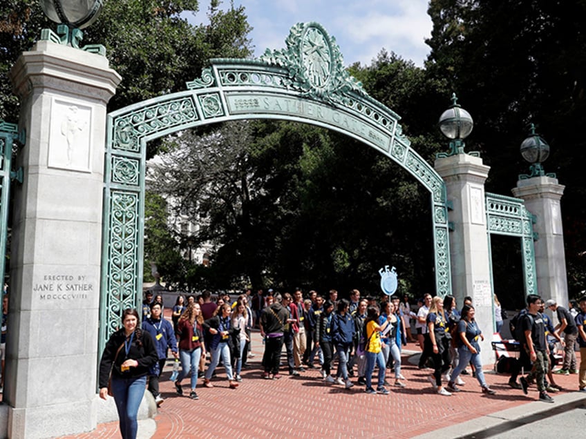 Students walk on the University of California, Berkeley campus in Berkeley, Calif., on Aug. 15, 2017. A group of residents that successfully challenged the university to limit its undergraduate enrollment offered to allow 1,000 more students in the upcoming academic year. Save Berkeley Neighborhoods said Saturday, March 5, 2022, it's willing to settle a lawsuit with the prestigious public university if UC Berkeley ends its effort to get out from this week's court order to cap enrollment to the 2020-21 school year level. (AP Photo/Marcio Jose Sanchez, File)