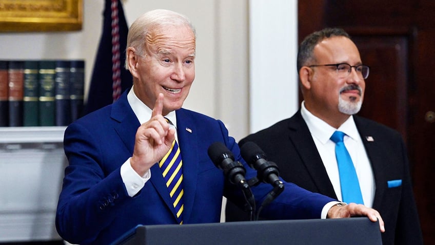 President Joe Biden with Education Secretary Miguel Cardona