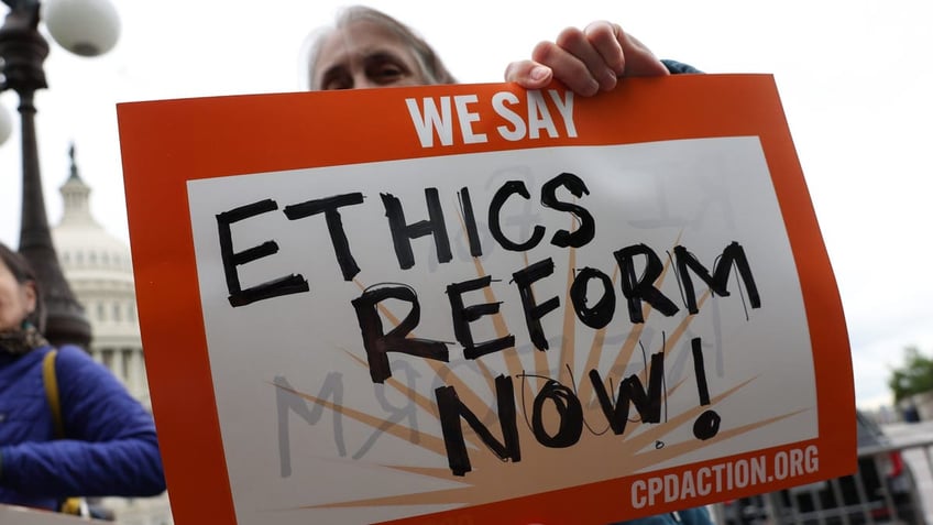 Activists attend a press conference on Supreme Court ethics reform outside the Capitol on May 2, 2023.