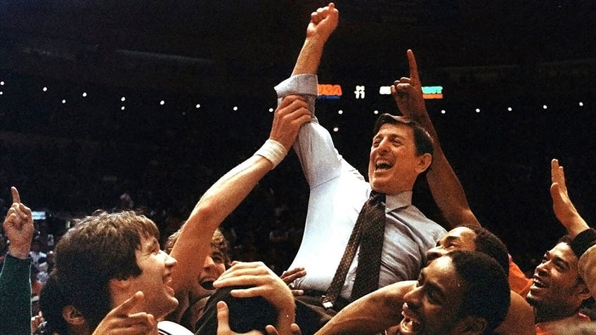 Lou Carnesecca carried by his team