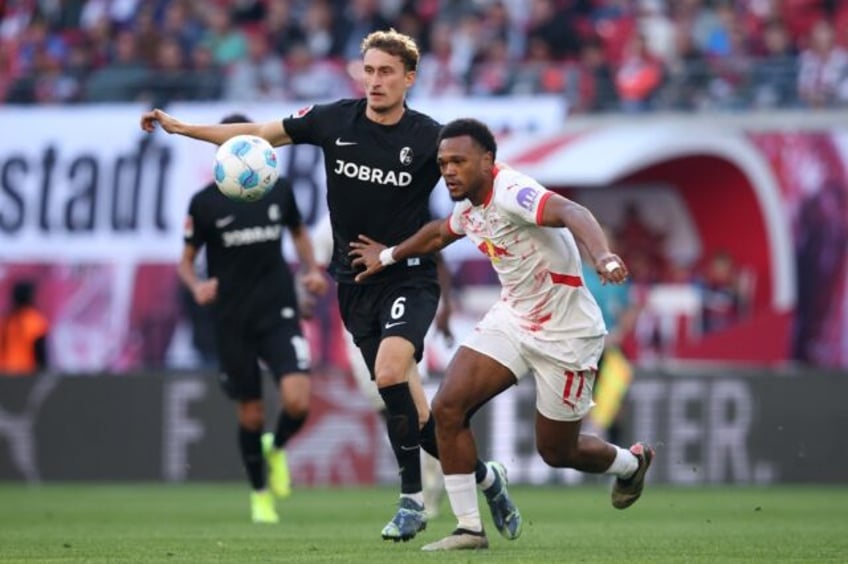 Lois Openda (R) scored in Leipzig's 3-1 home win over Freiburg