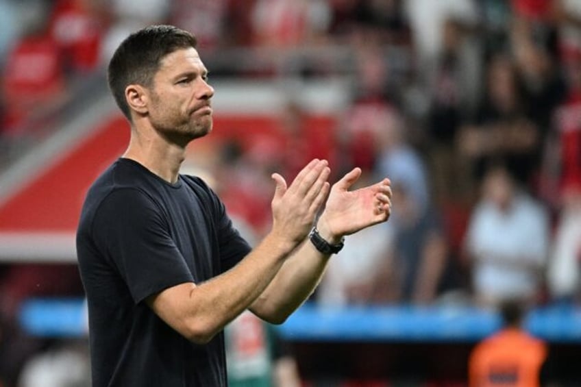 Bayer Leverkusen coach Xabi Alonso applauds fans after Saturday's 3-2 loss to RB Leipzig