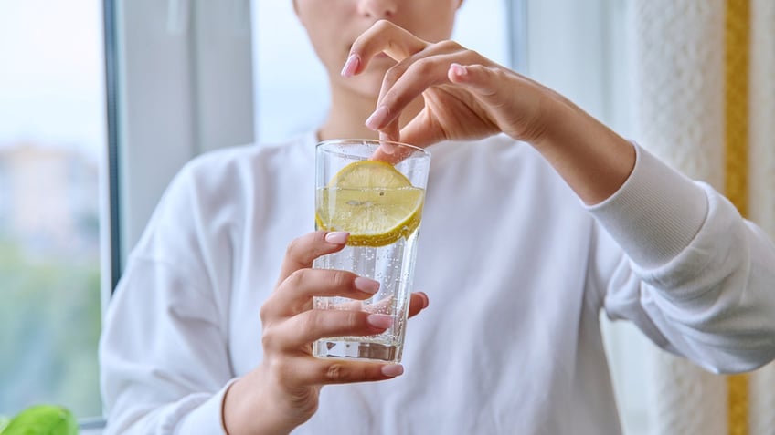 lemon water has its health benefits but should you drink it daily experts weigh in