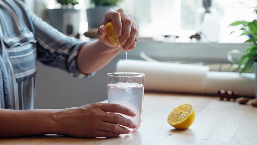 lemon water has its health benefits but should you drink it daily experts weigh in