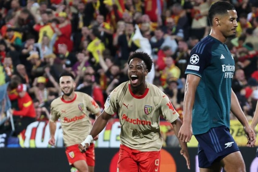 lens comeback stuns arsenal in champions league