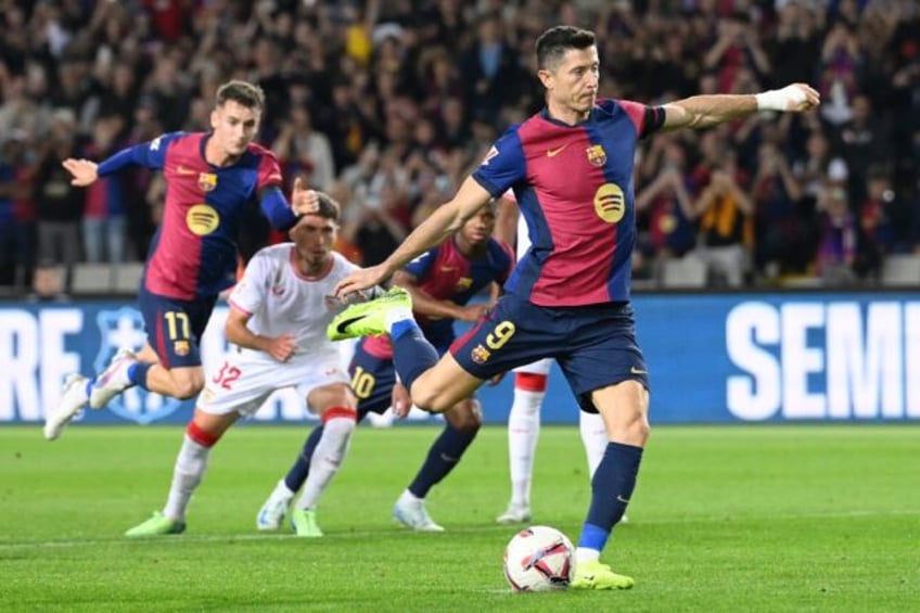 Barcelona's Polish forward Robert Lewandowski continued his stunning run of form with a br