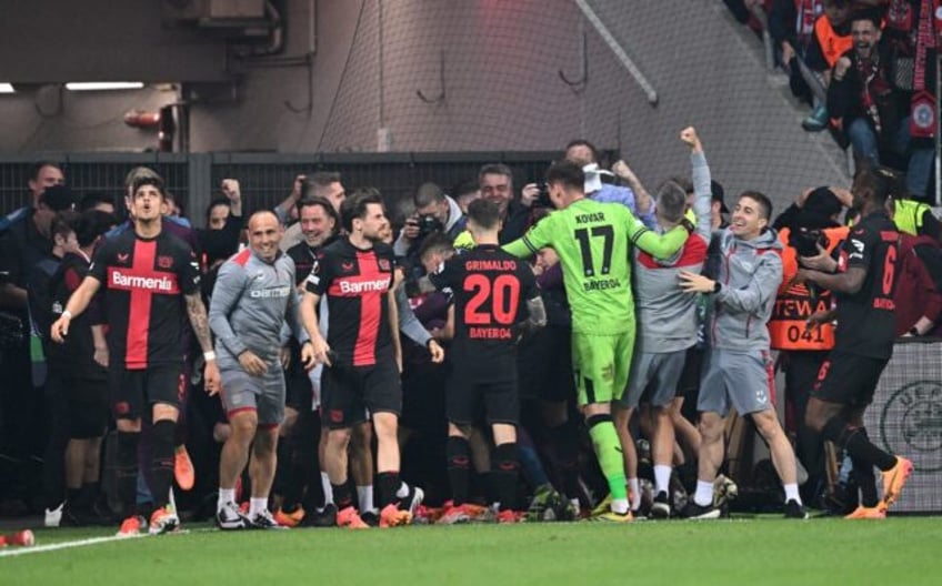 Leverkusen celebrates after defender Josip Stanisic scored in the seventh minute of injury