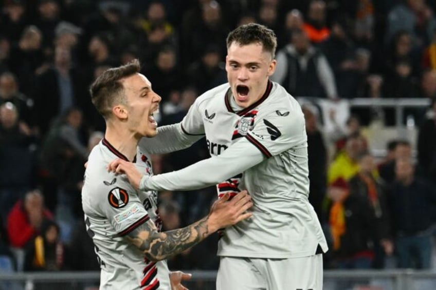 Florian Wirtz (R) celebrates his opener against Roma in the Europa League semi-finals