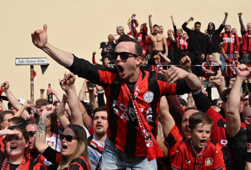 Bayer Leverkusen fans celebrate on a street renamed for coach Xabi Alonso on Sunday