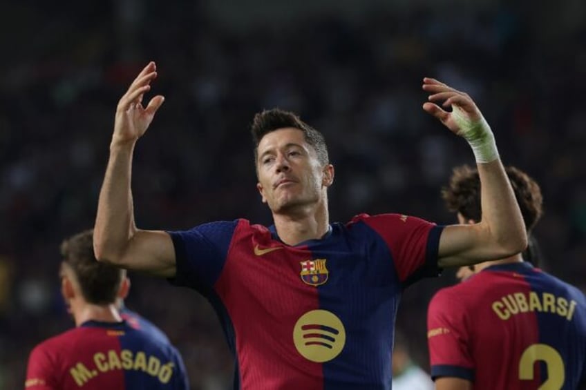 Barcelona's Polish forward Robert Lewandowski celebrates after scoring against Getafe