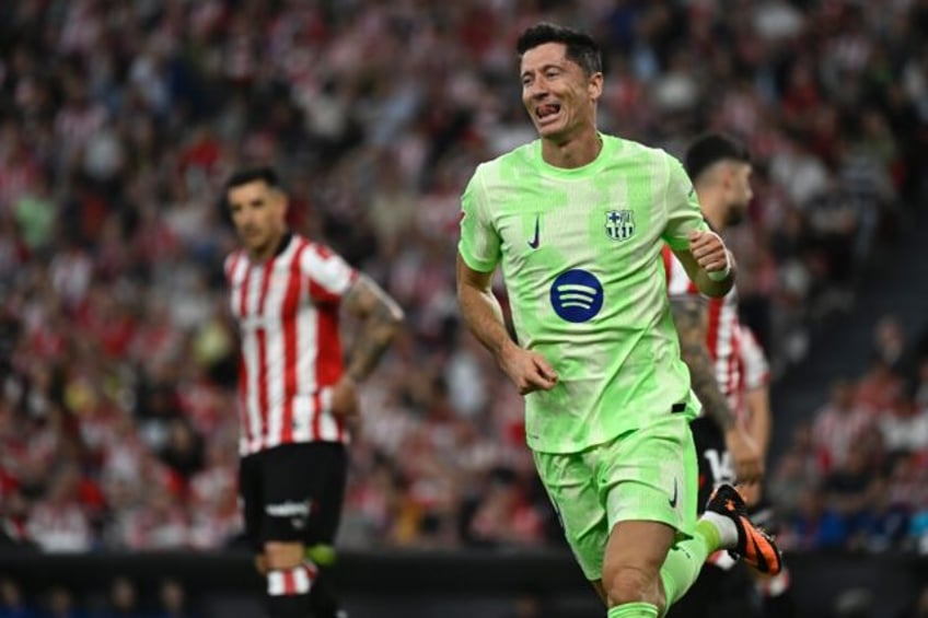 Barca's Robert Lewandowski netted twice to pass a century of goals for the club