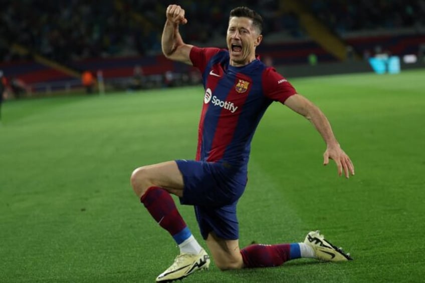 Robert Lewandowski struck twice in Barca's win over Valencia to ensure Real Madrid cannot