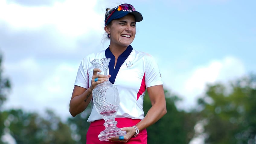 Lexi Thompson smiles with Solheim Cup