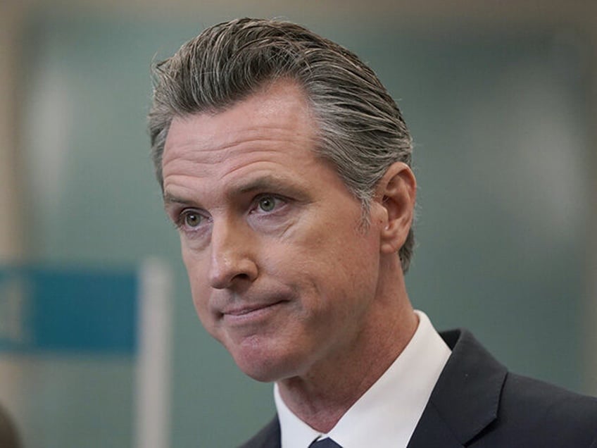 Biden - In this July 26, 2021, file photo, California Gov. Gavin Newsom appears at a news