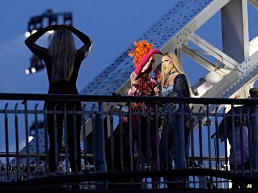 Drag queen Piche prepares to perform, at the Debilly Bridge in Paris, during the opening c