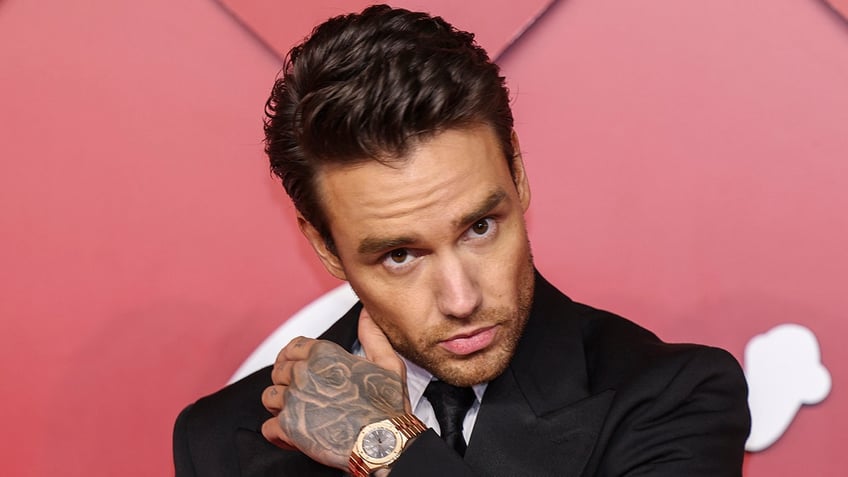 Liam Payne shows hand tattoo