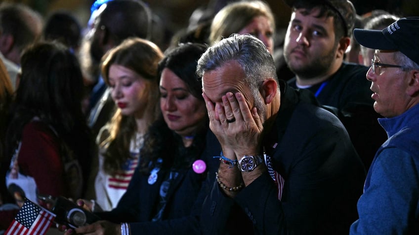 Supporters react to election results during an election night event for US Vice President and Democratic presidential candidate Kamala Harris at Howard University in Washington, DC, on November 5, 2024. 