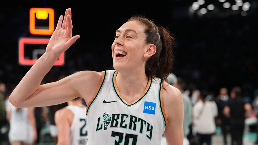 Breanna Stewart waves