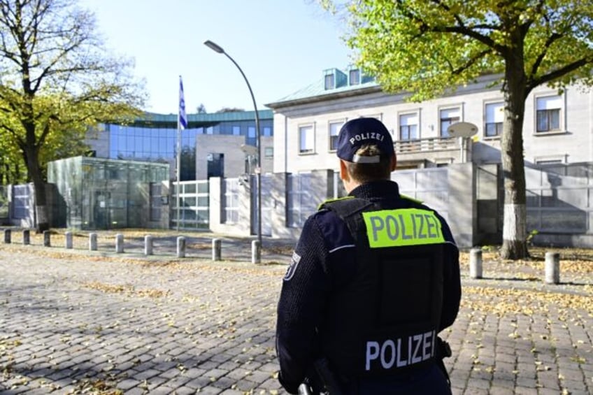 A police officer stands guard in front of the Israeli embassy in Berlin