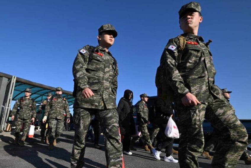 South Korean marines disembark from a passenger ferry at Yeonpyeong Island