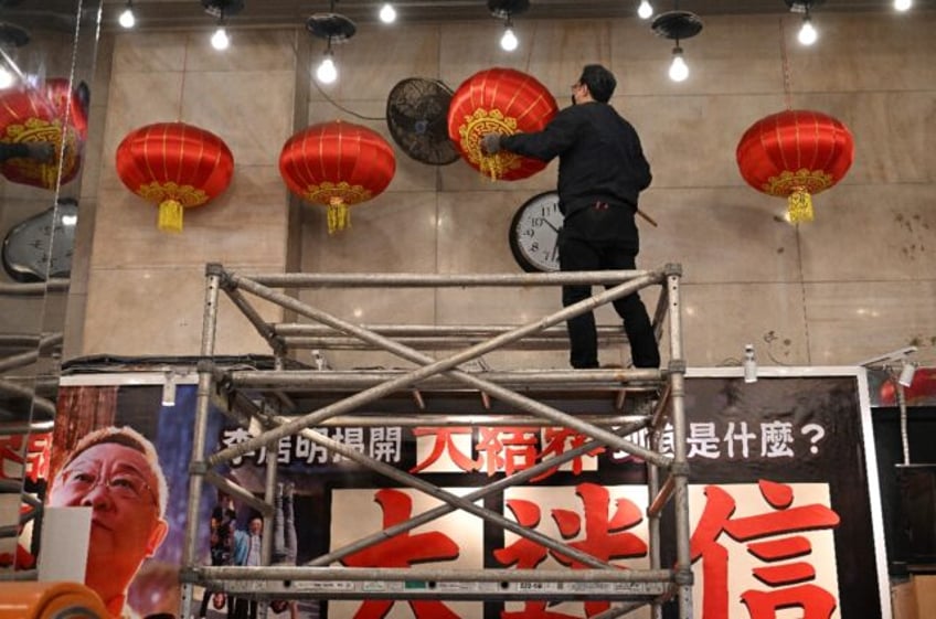 Its lobby was adorned with calligraphy, a gong and drum for good luck -- as well as 108 ro