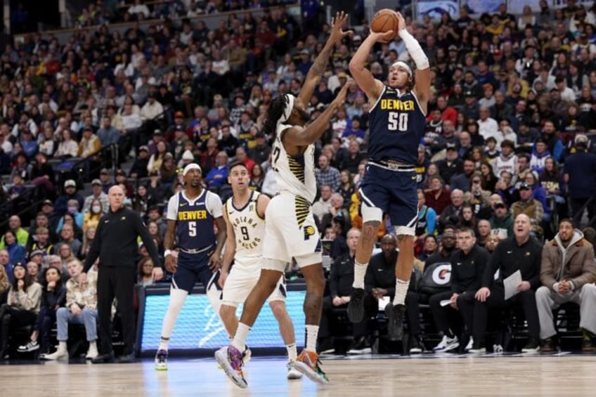 Denver's Aaron Gordon puts up a shot against Isaiah Jackson in the Nuggets' NBA victory over the Indiana Pacers