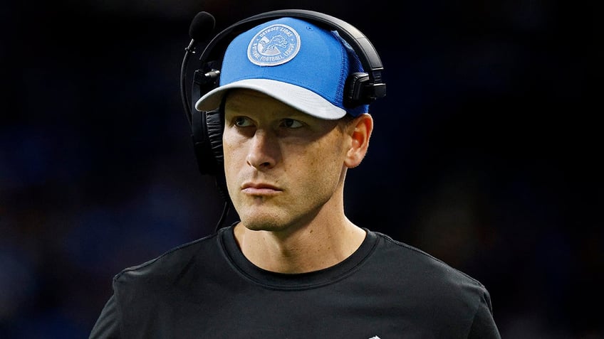 Ben Johnson stands on the sideline during a Lions game