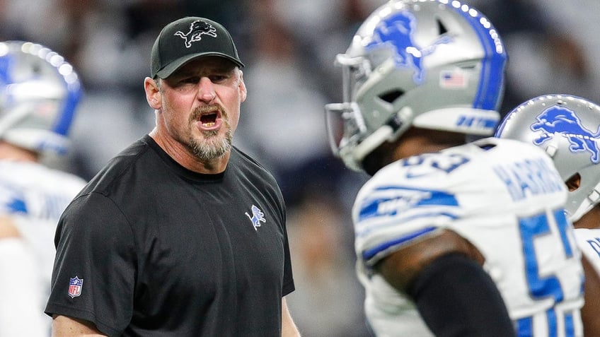 Dan Campbell talks to players