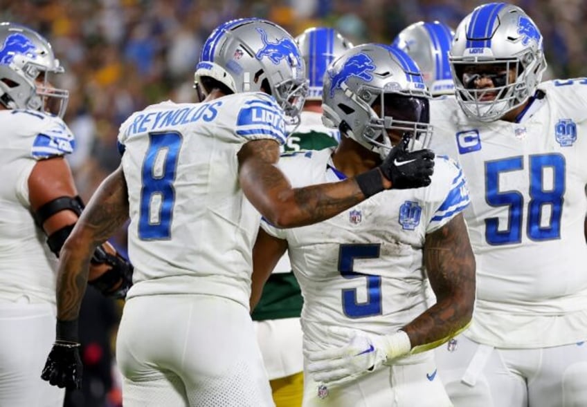 lions maul packers to take nfc north division lead