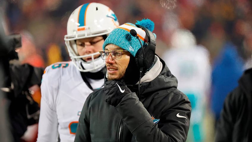 Mike McDaniel looks on from the sidelines