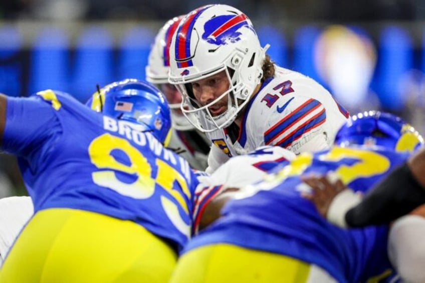 Buffalo Bills quarterback Josh Allen scores one of his three rushing touchdowns in last we