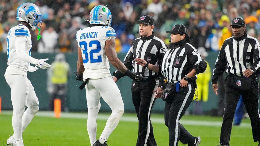 Brian Branch talks to officials