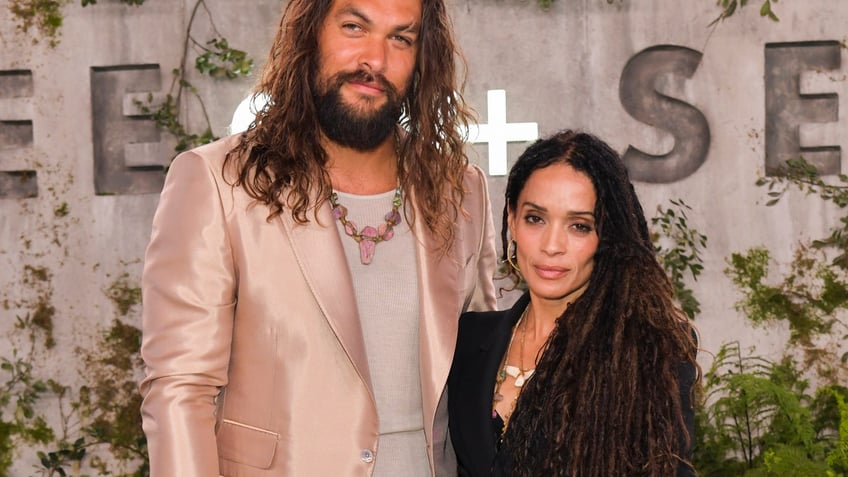 Actor Jason Momoa with Lisa Bonet at a movie premiere