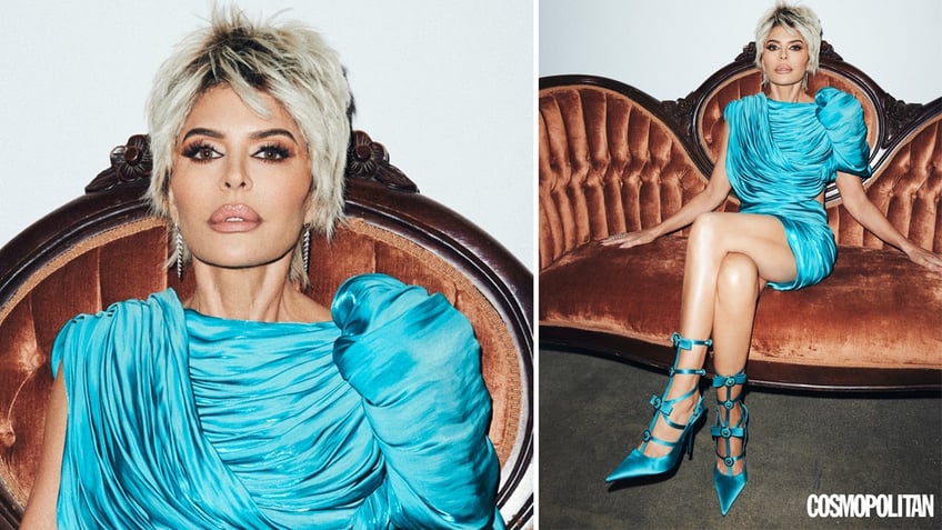 Lisa Rinna sits on a sofa wearing blue Versace ensemble