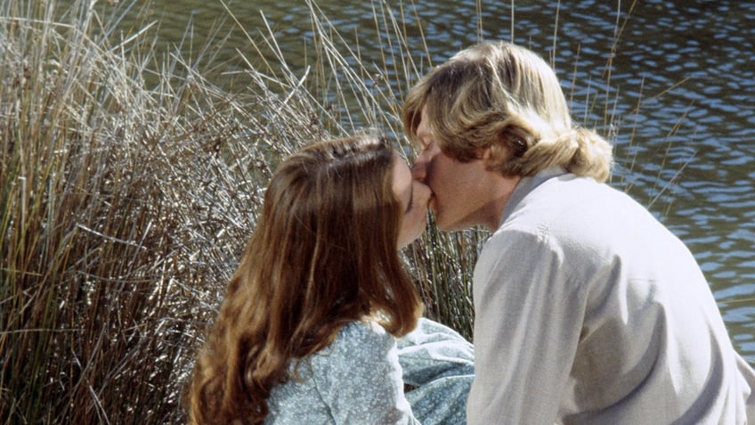 Melissa Gilbert kissing Dean Butler.