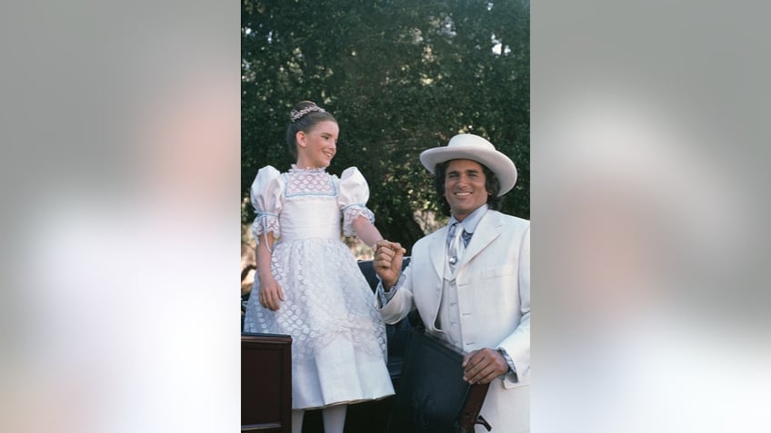 Michael Landon holding Melissa Gilberts hand