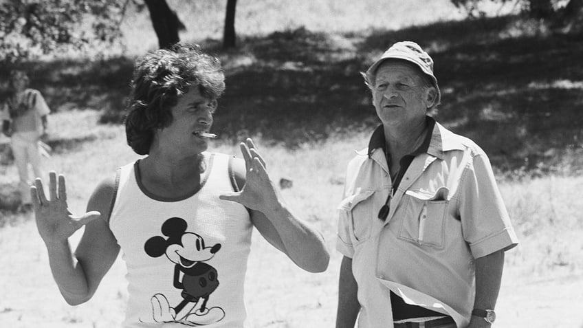 Michael Landon smoking and wearing a Mickey Mouse tank top