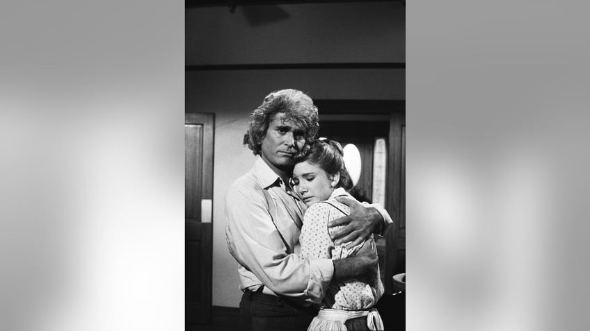 Melissa Gilbert embracing her TV dad Michael Landon in costume.