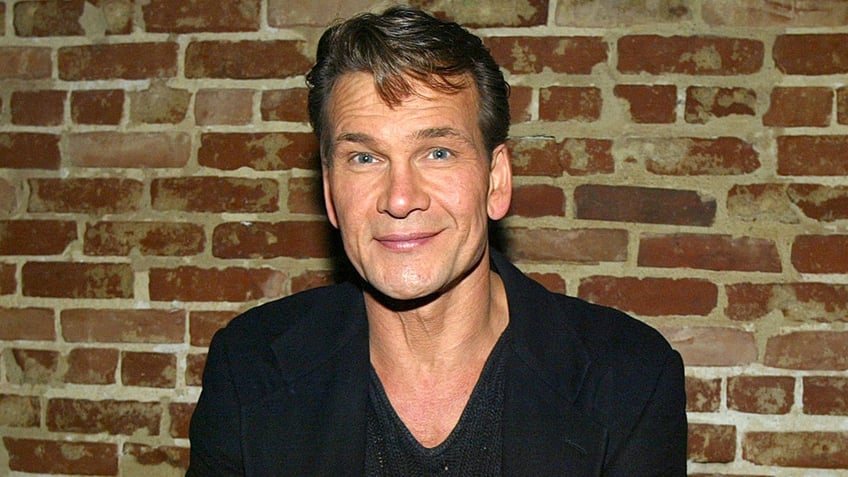 A close-up of Patrick Swayze wearing a black shirt