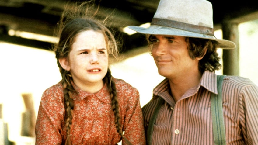 A close-up of a young Melissa Gilbert and Michael Landon in costume