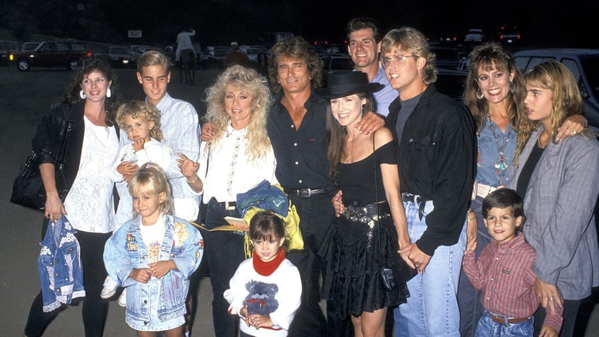 Michael Landon surrounded by his children.