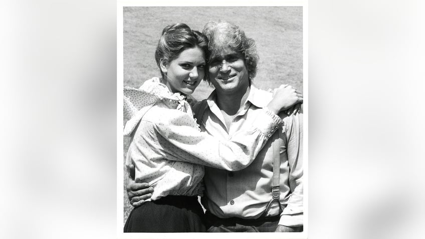 Leslie Landon Matthews embracing Michael Landon on set.