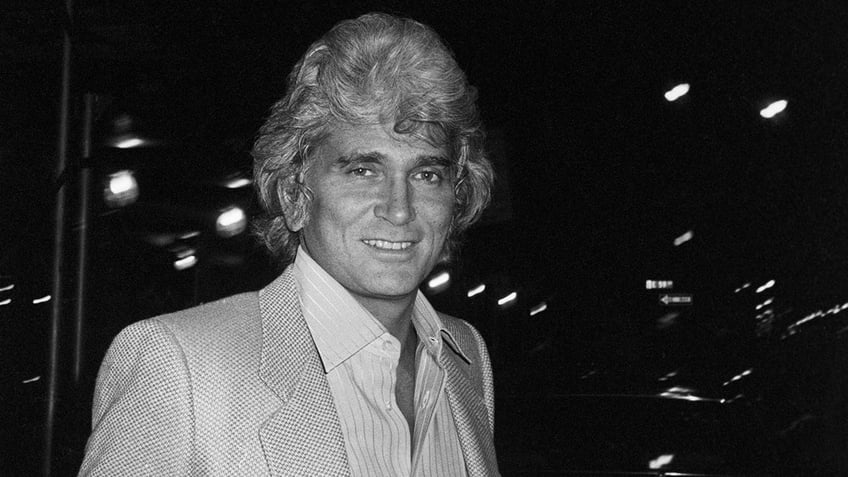 A close-up of Michael Landon smiling with grey hair