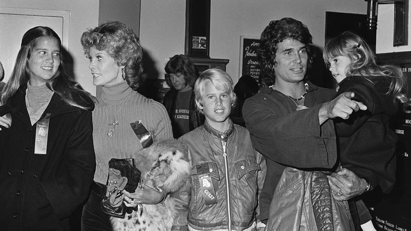 Michael Landon walking with his children.