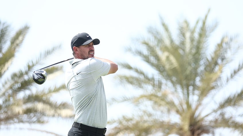 Brooks Koepka plays a tee shot