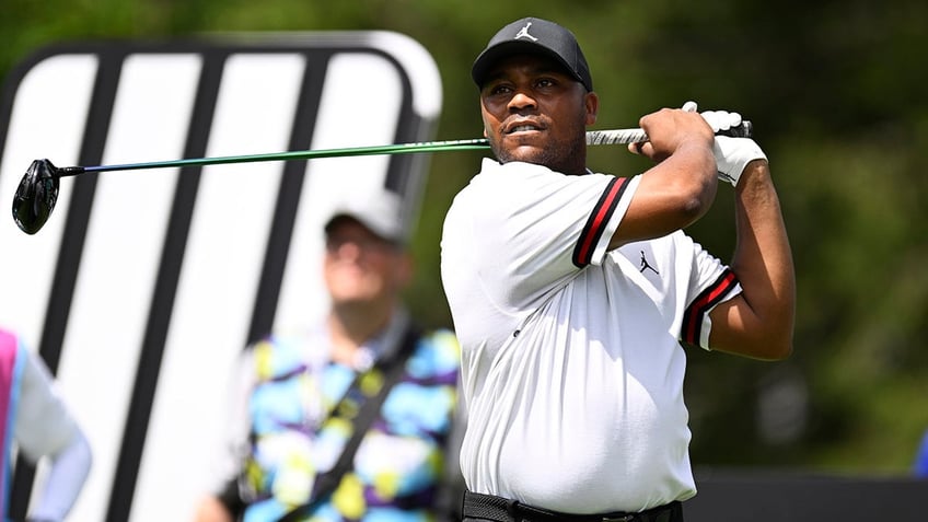 Harold Varner III tees off