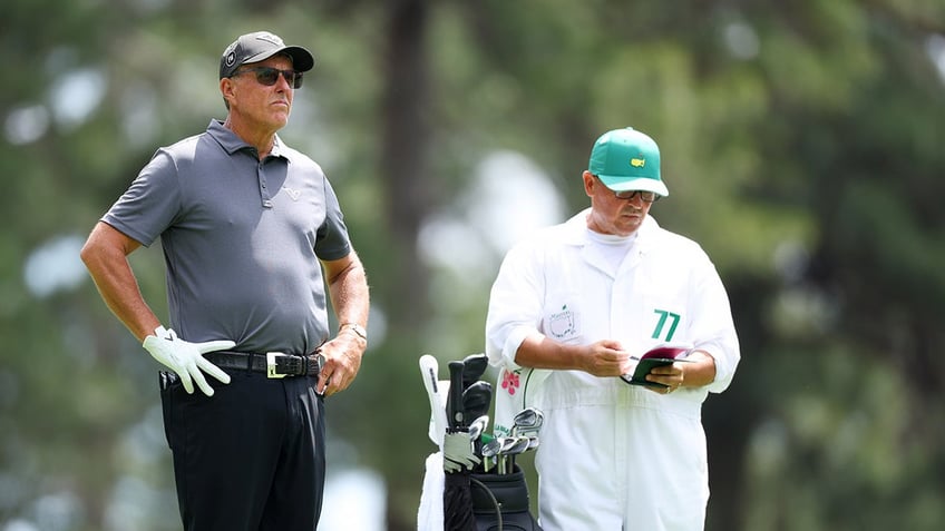 Phil Mickelson looks on from Augusta national