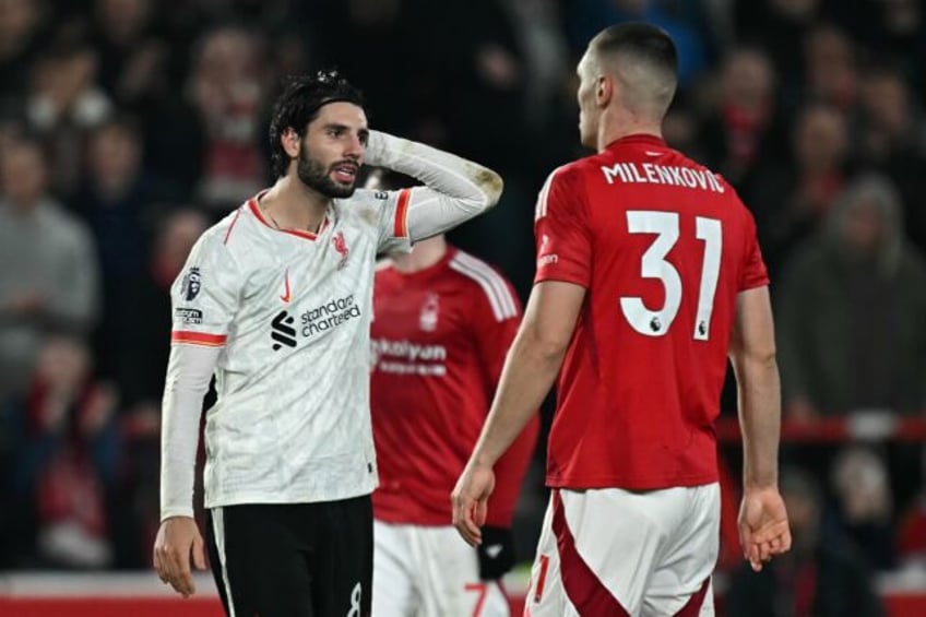 Liverpool's Dominik Szoboszlai (L) shows his frustration during the draw at Nottingham For